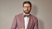Abhishek Bachchan speaking about criticism and public perception alongside Saurabh Shukla