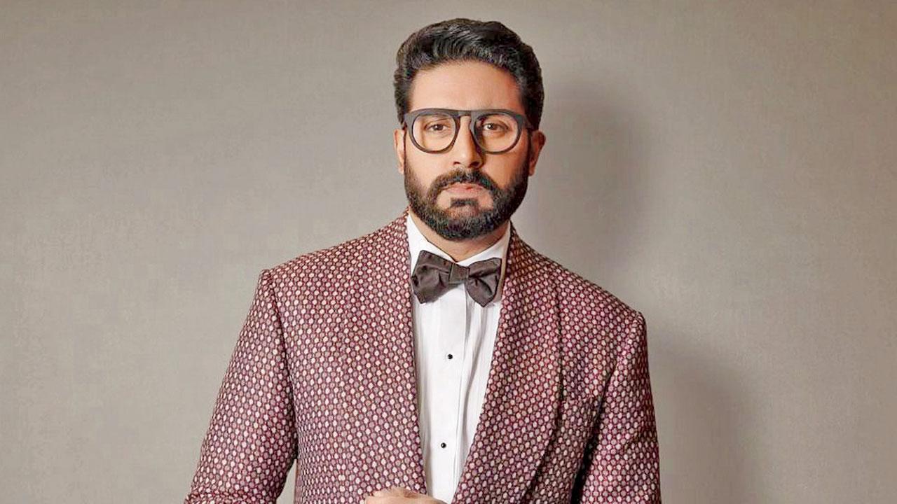 Abhishek Bachchan speaking about criticism and public perception alongside Saurabh Shukla