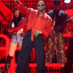 Usher pauses an on-stage fan interaction during his Nashville concert after noticing a woman appeared uncomfortable.