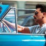 Ranbir Kapoor’s intense first look from Sanjay Leela Bhansali’s Love & War featuring a vintage car and a bloodied hand.