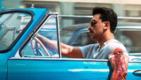 Ranbir Kapoor’s intense first look from Sanjay Leela Bhansali’s Love & War featuring a vintage car and a bloodied hand.